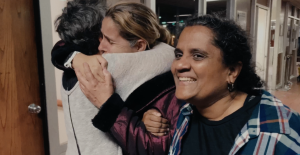 (Las Abogadas): Production Still 2 - Attorneys Charlene D'Cruz and Rebecca Eichler welcome Cuban migrant at border